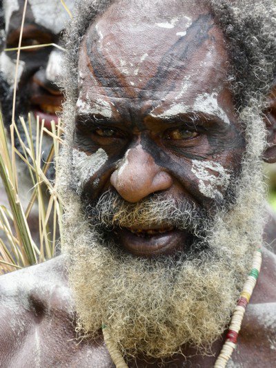 Close-up of man from tribe who once practiced cannibalism