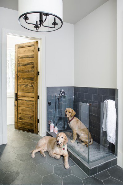 Dog wash in mudroom features easy-to-clean slate tiles.