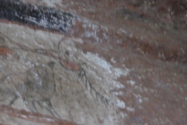 Wall painting depicting the cock that crowed 3 times signaling Peter’s denial of Christ