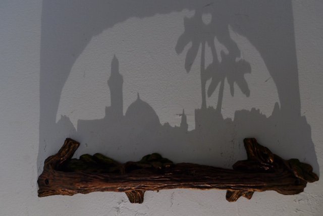 Very cool art. A log carved such that when lit from the correct angle, the silhouette is an image.