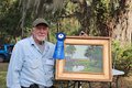 Paul Ladnier with his blue ribbon winning painting from the Paint Quick competition at Musgrove