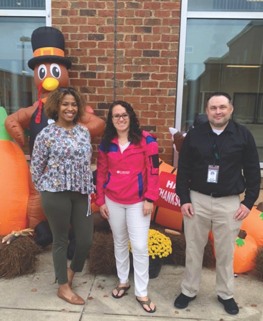 CIS High School Site Coordinators Courtney Lucas (BHS), Jazmin Ponce (GA) and Corey Adamson at a Thanksgiving lunch for parents hosted by BHS and GA PTAs.