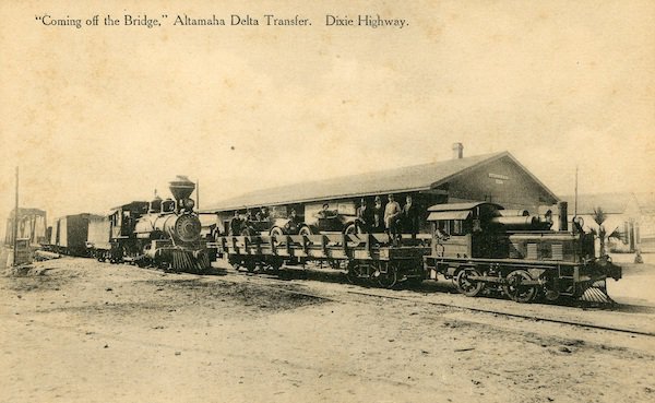 A Georgia Coast &amp; Piedmont train at Darien, loaded with cars for the trip across the Altamaha River Delta