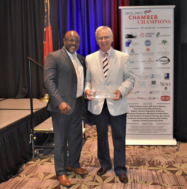 Incoming Chamber Board President Cedric King with outgoing Chamber Board Chairman Mike Scherneck