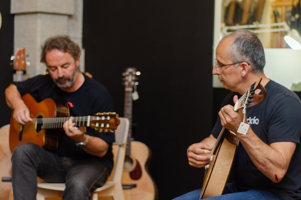 Porto Guitarra owner Tico Rodrigues (right) and Carlos Araujo treating the students to a concert