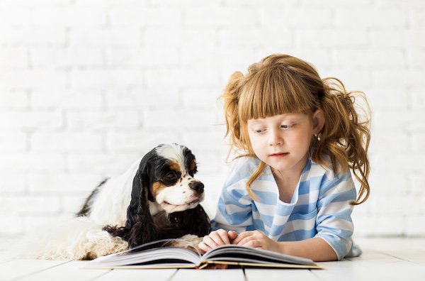 Girl reading to dog.jpeg