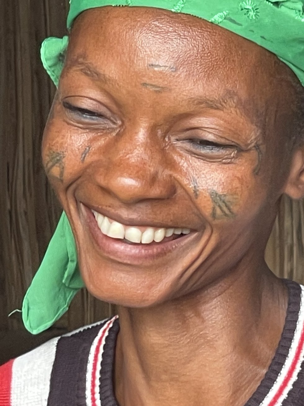 Beninese woman green scarf