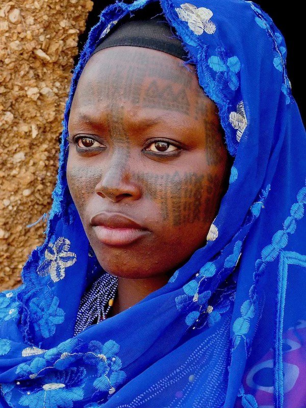 Fulani woman in blue scarf.jpeg