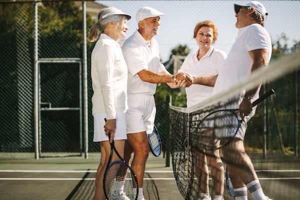 adults playing tennis.jpeg
