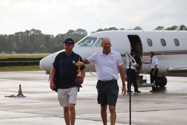 Davis Love III and Matt Kuchar arriving home with the Ryder Cup