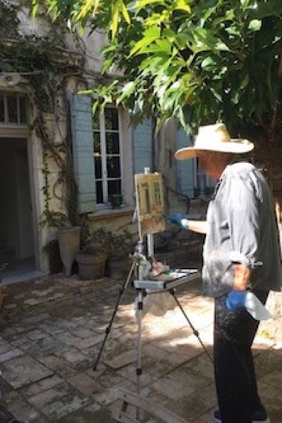 Ken painting at the house