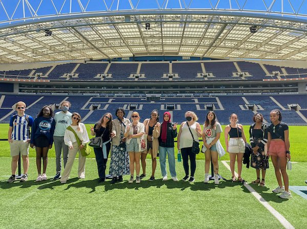 The entire group of USG Porto study abroad students on the pitch at the Dragão Stadium.