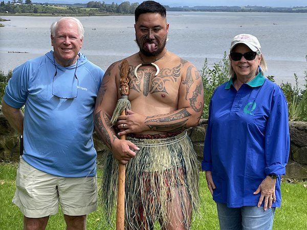 Duane and Carol with Maori warrior demonstrating pukana .jpeg